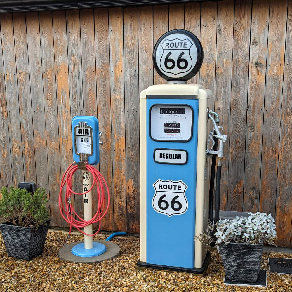 Route 66 reproduction gas pump and air metre in man garage